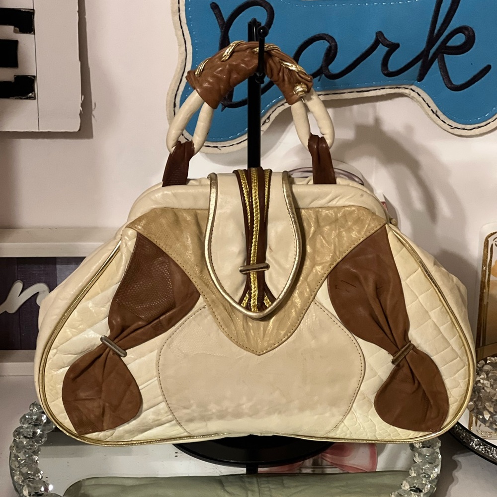vintage multi-textured leather with a top handle and gold-tone hand bag